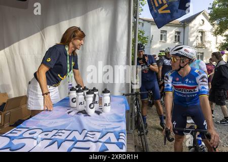 Lennik, Belgium. 10th Aug, 2024. Remco's mother Agna Van Eeckhout and Belgian Remco Evenepoel of Soudal Quick-Step pictured during the second edition of the R.EV Ride, in Schepdaal, Lennik, on Saturday 10 August 2024. The track of this tour follows Evenepoel's favourite training routes through the Pajottenland, the Flemish Ardennes and the Pays des Collines. After the ride fans can meet their idol in the fan village. BELGA PHOTO NICOLAS MAETERLINCK Credit: Belga News Agency/Alamy Live News Stock Photo