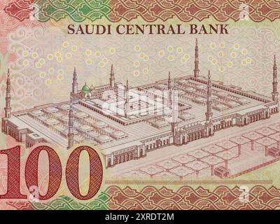 Closeup of Saudi Arabia one hundred riyals banknote portrait the Prophet's Mosque, Al Madinah Al Monawarah (Masjid Nabawi). Stock Photo