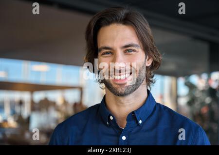 Happy young professional business man looking at camera, headshot portrait. Stock Photo