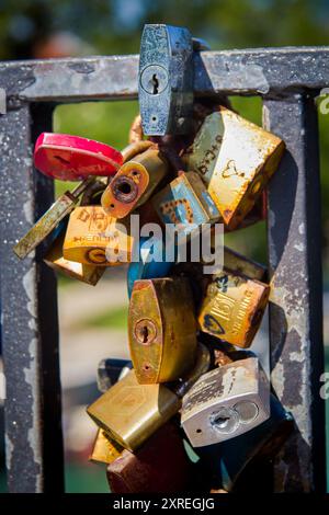 Love lock or love padlock is a padlock that couples lock to symbolize their love and let it last forever Stock Photo
