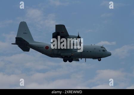 A Lockheed C130R Hercules military transport plane with the Japanese Maritime Self Defence Force (JMSDF) flying near NAF Atsugi airbase in Japan Stock Photo
