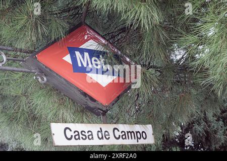 Madrid, Spain, January 25th 2024: Madrid’s Metro Signage Amidst Greenery Stock Photo