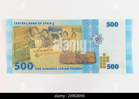 Syria five hundred pounds banknote features Mosaic of the Musicians from a Byzantine villa in Maryamin. The clay tablet depicts the Hurrian songs Stock Photo