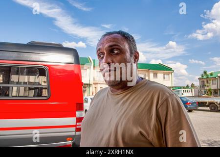 arab adult male mid age wearing casual clothing in the yard of a residential complex Stock Photo