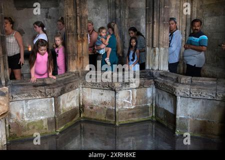 St Winefrides Shrine and holy well. Holywell Flintshire. Catholic pilgrimage on the feast day of  Saint Winefride 22nd June. Pilgrims queue up waiting their turn to venerate Saint Winefrides Relic. Saint Winefride's Feast Day Pilgrimage.  Wales June 2023. 2000s UK HOMER SYKES Stock Photo