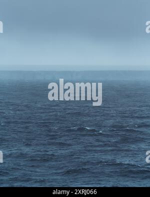 A23a Largest Iceberg in the World Antarctica Moody Clouds Fog and Dark Ocean. Ice Shelf Climate Change Scenic Cruise View Stock Photo