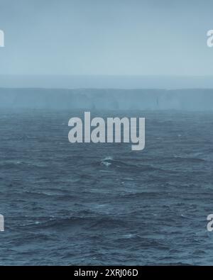 A23a Largest Iceberg in the World Antarctica Rough Seas Moody Clouds Fog and Dark Ocean. Ice Shelf Climate Change Scenic Cruise View Stock Photo