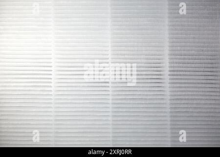 A textured background features a delicate grid with variations in tone and light. Stock Photo
