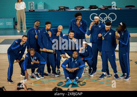 Paris, France. 10th Aug, 2024. Gold medallists (From L) USA's #04 Stephen Curry, USA's #07 Kevin Durant, USA's #05 Anthony Edwards, USA's #09 Tyrese Haliburton, USA's #08 Derrick White, USA's #10 Jayson Tatum, USA's #06 LeBron James, USA's #11 Joel Embiid, USA's #13 Bam Adebayo, USA's #14 Anthony Davis, USA's #15 Devin Booker and USA's #12 Jrue Holiday pose on the podium after the men's Gold Medal basketball match between France and USA during the Paris 2024 Olympic Games at the Bercy Arena in Paris on August 10, 2024. Photo by Eliot Blondet/ABACAPRESS.COM Credit: Abaca Press/Ģ����ý Live News Stock Photo