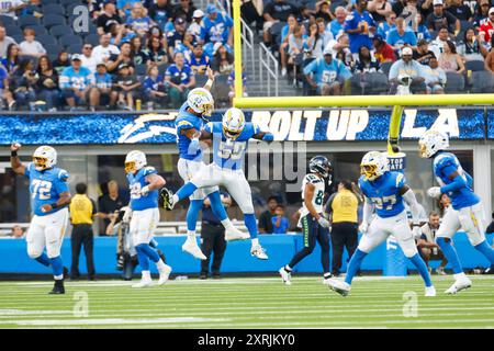 Los Angeles Chargers players celebrate an interception by safety RJ ...