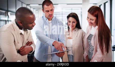 Business Team Using Tablet Technology. Standing Teamwork Stock Photo