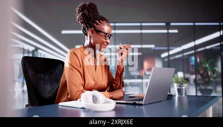 Business Woman Using Mobile Phone Technology And Laptop Stock Photo