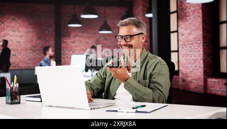 Man Calls Using Smart Phone. Mobile Voice Message Stock Photo