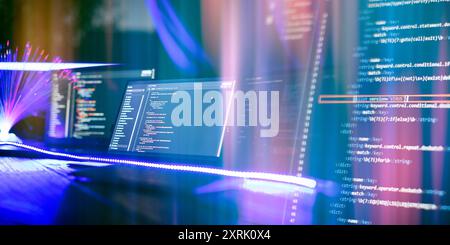 Program code on a computer monitor with fiber optic background. Internet and technology concept. Stock Photo