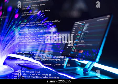 Program code on a computer monitor with fiber optic background. Internet and technology concept. Stock Photo