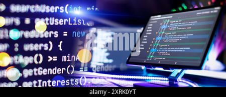 Program code on a computer monitor with fiber optic background. Internet and technology concept. Stock Photo