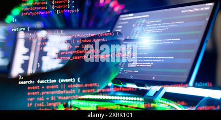 Program code on a computer monitor with fiber optic background. Internet and technology concept. Stock Photo