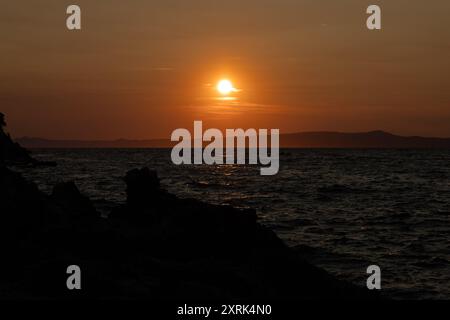 Sunset in Croatia in love on the sea shore Trpanj Croatia Stock Photo