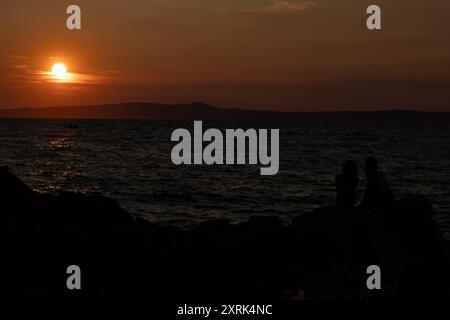 Sunset in Croatia in love on the sea shore Trpanj Croatia Stock Photo