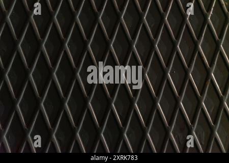 The texture of a metal sheet with diamond-shaped corrugation. Stock Photo