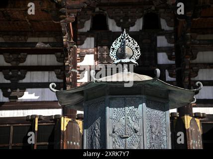 Relief work of Bodhisattva on the Kondo Hakkaku Tōrō Octagonal Lantern in front of the Great Buddha Hall at Tōdai-ji Buddhist Temple in Nara Japan Stock Photo