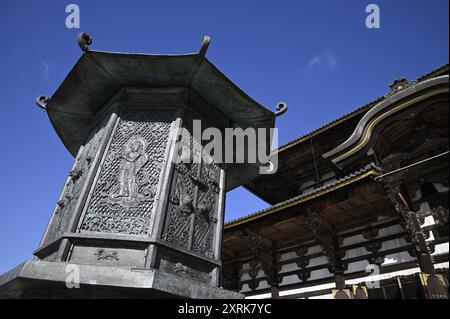 Relief work of Bodhisattva on the Kondo Hakkaku Tōrō Octagonal Lantern in front of the Great Buddha Hall at Tōdai-ji Buddhist Temple in Nara Japan Stock Photo