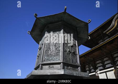 Relief work of Bodhisattva on the Kondo Hakkaku Tōrō Octagonal Lantern in front of the Great Buddha Hall at Tōdai-ji Buddhist Temple in Nara Japan. Stock Photo