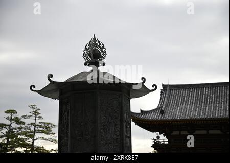 Relief work of Bodhisattva on the Kondo Hakkaku Tōrō Octagonal Lantern in front of the Great Buddha Hall at Tōdai-ji Buddhist Temple in Nara Japan. Stock Photo