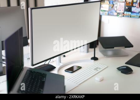 Empty computer monitors. Screen mockup. Home office studio. Workplace interior. Stock Photo
