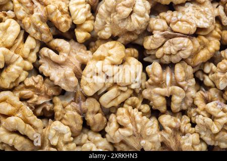 Texture of peeled Walnuts  as background, close-up. Selective focus Stock Photo