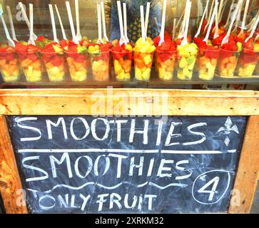 Freshly cut fruits on display of the small shop Stock Photo