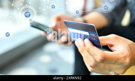 Hands holding a credit card and using smart phone for online shopping, Marketplace platform and digital marketing concept Stock Photo