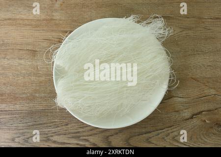 dry instant vermicelli thin noodles raw food arranging on plate Stock Photo
