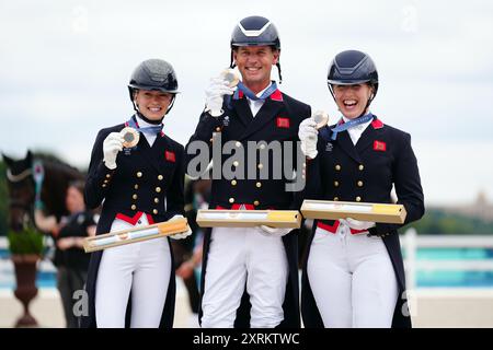 File photo dated 03/08/24 of Great Britain's Charlotte Fry, Carl Hester and Becky Moody after winning a bronze medal in the Dressage Team Grand Prix Special. Issue date: Sunday August 11, 2024. Stock Photo