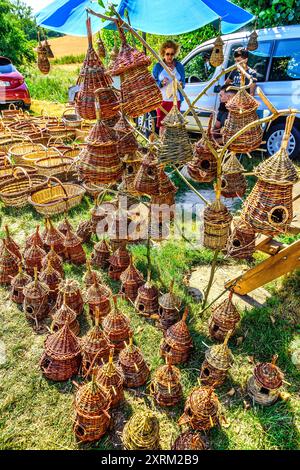 Display of woven hanging bird houses at country fair - central France. Stock Photo