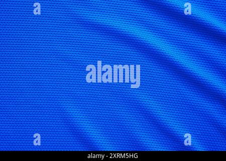 Blue football jersey clothing fabric texture sports wear background, close up top view Stock Photo