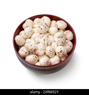 Bowl with puffed Lotus seed isolated on white background close up Stock Photo