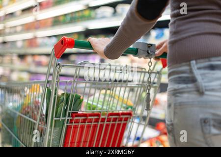 Close-up detail of a woman shopping in a supermarket Stock Photo