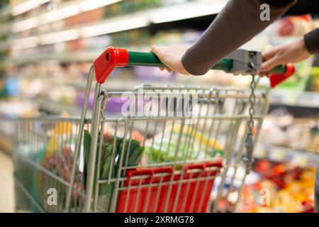 Close-up detail of a woman shopping in a supermarket Stock Photo