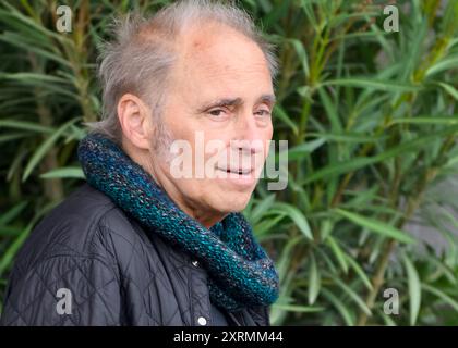 STOCKHOLM, SWEDEN - JULY 18, 2024: Nils Lofgren  leaving The Grand Hotel in Stockholm for a concert with Bruce Springsteen and the E Street Band. Stock Photo