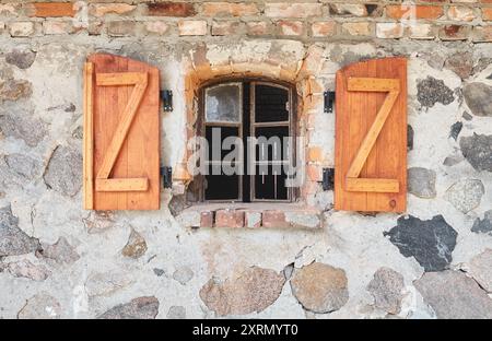 An old wall with an open window. Stock Photo