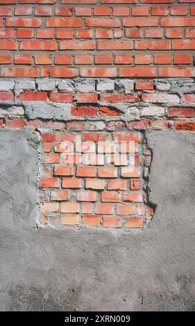 Photo of an old weathered brick wall, background or texture. Stock Photo