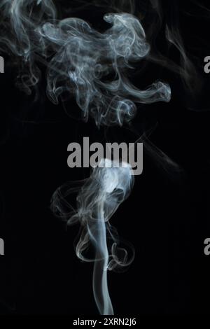 Abstract white smoke texture moves on black background Plume of smoke wave design wallpaper. Design element. Abstract texture Stock Photo