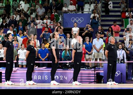 Paris, France. 11th Aug, 2024. Julio Velasco, head coach of Italy (1r) and the team staff during the national anthem before the Volleyball gold medal match between United States of America and Italy during the Paris 2024 Olympic Games at Arena Paris Sud 1 in Paris (France), August 11, 2024. Italy defeated United States 3-0 and won the gold medal. Credit: Insidefoto di andrea staccioli/Alamy Live News Stock Photo