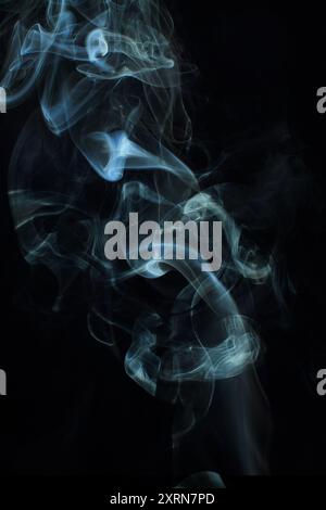 Abstract white smoke texture moves on black background Plume of smoke wave design wallpaper. Design element. Abstract texture Stock Photo