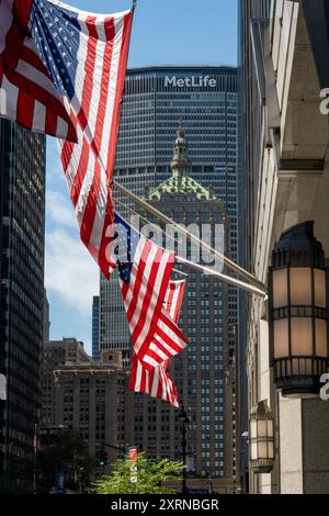 American Flags on 320 Park Avenue with The Helmsley Building in the Background, 2024, NYC, USA Stock Photo