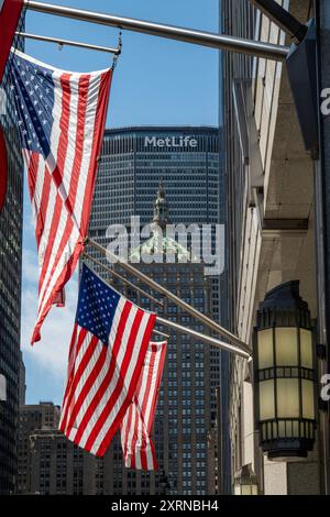 American Flags on 320 Park Avenue with The Helmsley Building in the Background, 2024, NYC, USA Stock Photo