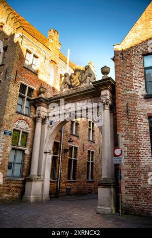 Coat of Arms of Flanders and Pro Patria Gate in Bruges, Belgium. Stock Photo