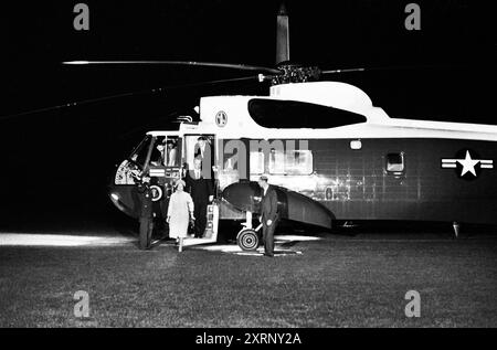 U.S. President Lyndon Johnson and First Lady Claudia 'Lady Bird' Johnson arriving on South Lawn from Dallas, Texas, via Andrews Air Force Base, Secretary of Defense, Robert S. McNamara, exiting U.S. Army helicopter behind President Johnson; Secret Service agent, Rufus Youngblood, standing right of stairs, White House, Washington, D.C., USA, Robert Knudsen, White House Photographs, November 22, 1963 Stock Photo