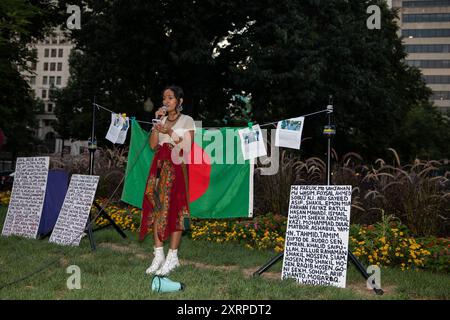 Amad Mahbub, a Bangladeshi artist is giving a speech while the Bangladeshi community is holding a candlelight vigil on August 11, 2024, in McPherson Square, Washington DC, USA, to pay tribute to the martyred students, who are dying in the quota movement in Bangladesh. After mass killings by the law enforcement agency, the quota movement turned into an anti-government protest that led to an uprising that ended the 15-year authoritarian rule of Sheikh Hasina. Nobel laureate Muhammad Yunus and his newly named interim government set out on August 9th. Credit: Aashish Kiphayet/Alamy Live News Stock Photo